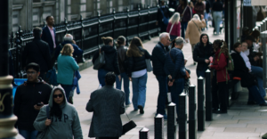 A crowd of people on the pavement in Westminster, London